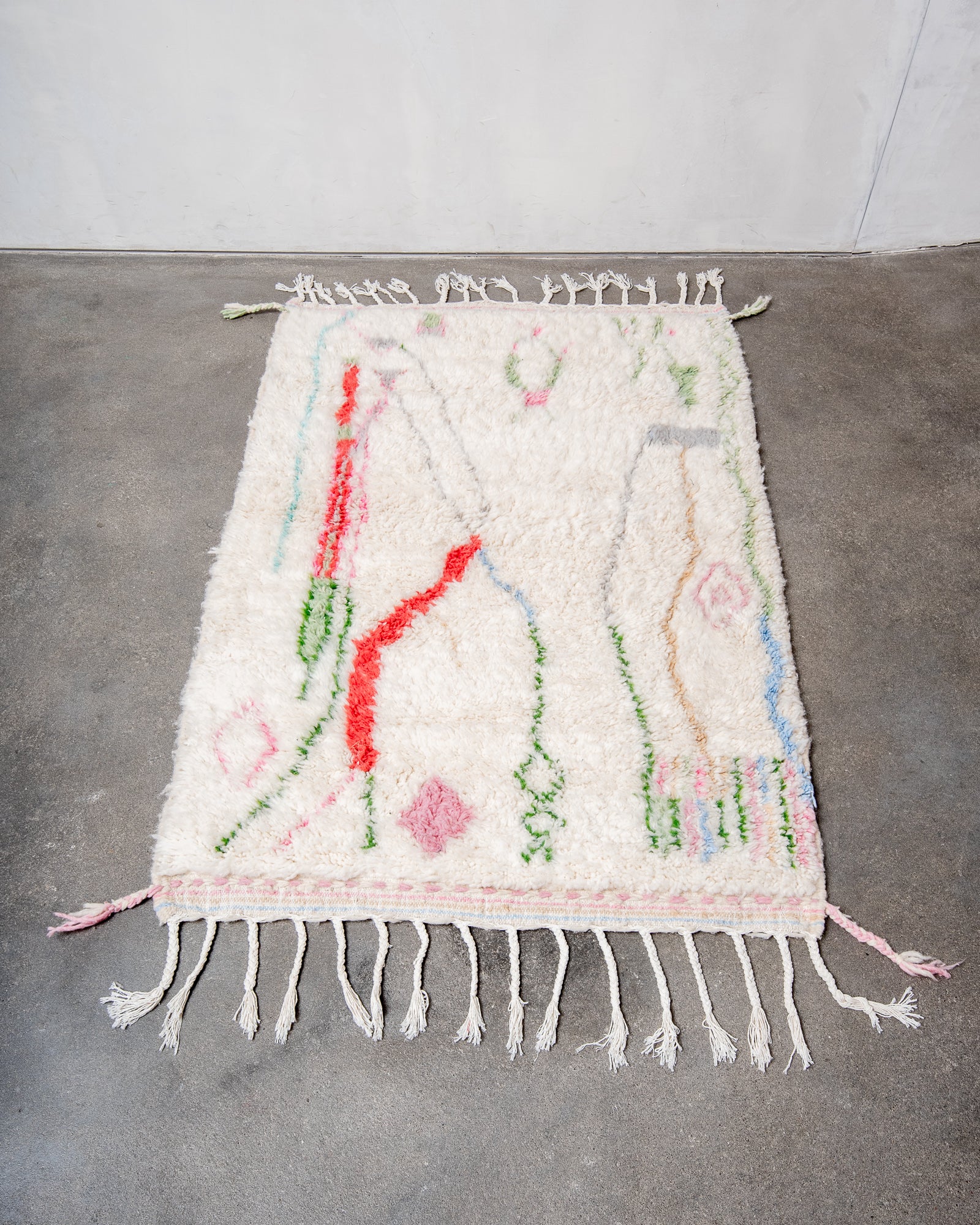 Modern, designer, handcrafted Berber rug from Morocco. Beniourain carpet with beautiful colours and patterns and fluffy wool texture.